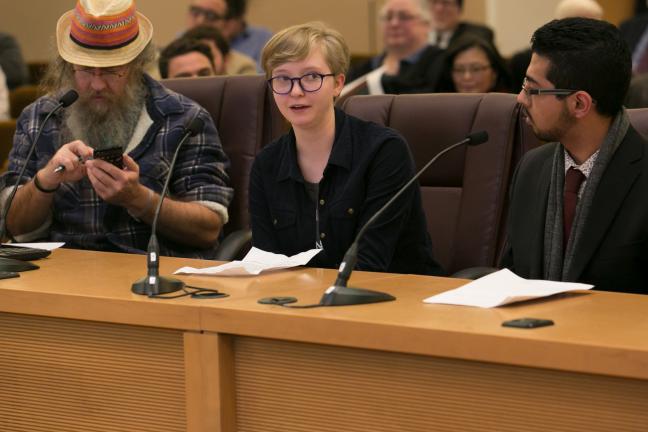 Fiona McClary (center) a junior at St. Mary’s Academy, speaks before Multnomah County Board on Clean Air Oregon draft plan