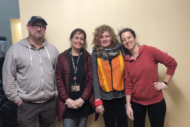 Volunteers including Justin Ross of Emergency Management, left, and Anna Plumb, right, of the Department of County Management.
