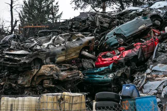 Charred cars stacked at a scrap yard in northeast Portland