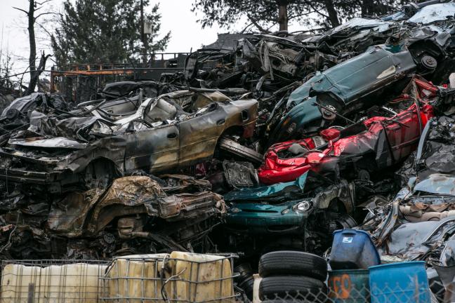 Charred cars stacked at a scrap yard in northeast Portland