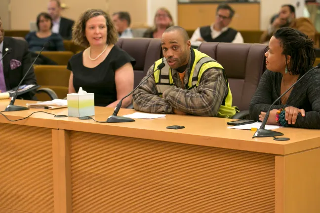 Laborer apprentice Gregory Roseboro addresses the Board of Commissioners at the March 13 meeting.