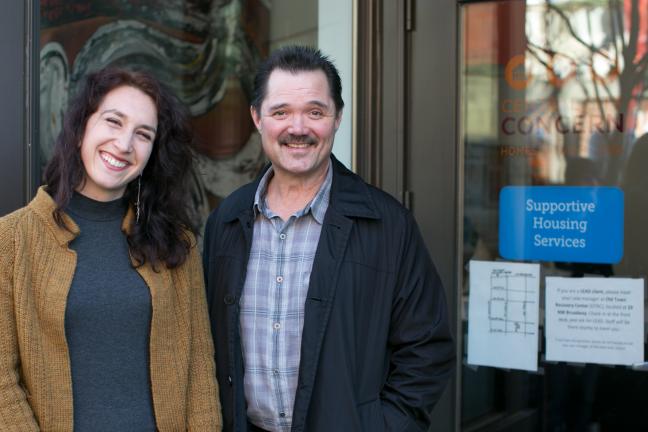 53-year-old Ty Grove poses with Central City Concern case manager Juliana DePietro