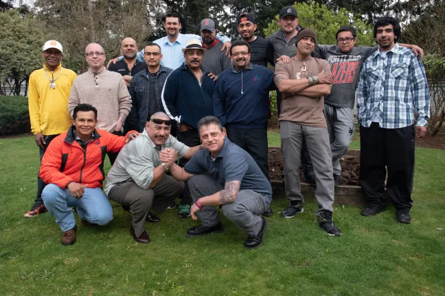 Residents, graduates and staff of the Latino Homebase Recovery program gather on a recent Saturday for a barbecue