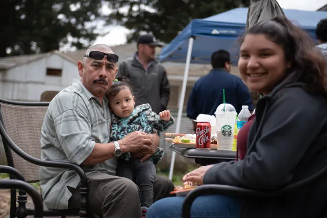 Luis Ortega, a graduate of Latino Homebase Recovery, brings his girls back for a Saturday barbecue with current residents.