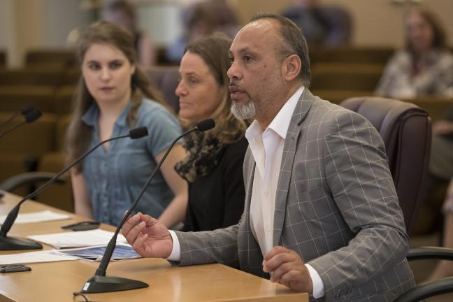 Alberto Moreno, Chair of the state's Commission on Hispanic Affairs, briefs commissioners on disparities in mental health.