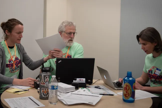Mid Count Health Center staff help refugee families verify required immunization records for green card applications at RAD 2018.