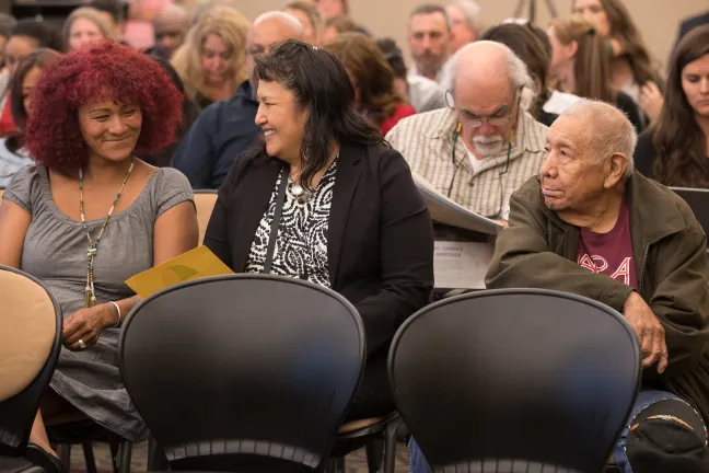 Roberta Eaglehorse-Ortiz, far left, waits with others to testify on the county's 2019 budget.