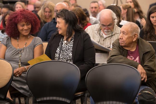 Roberta Eaglehorse-Ortiz, far left, waits with others to testify on the county's 2019 budget.