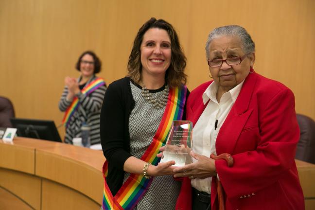 Chair Kafoury (left) presents Kathleen Saadat with the inaugural Community Advocate Award