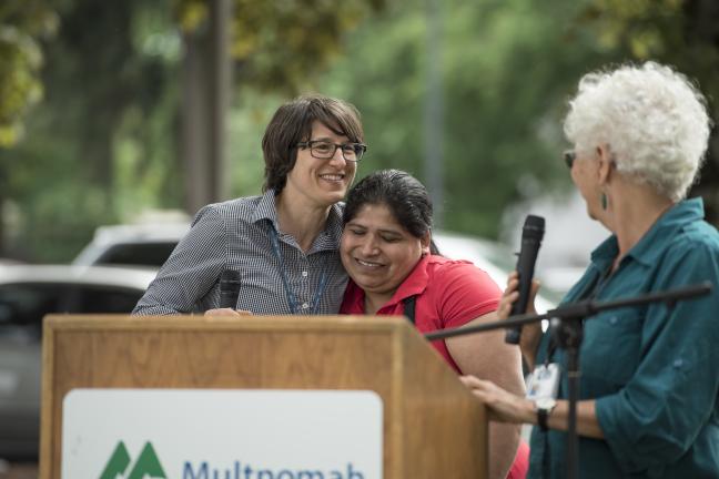 CSA coordiantor Katy Pranian hugs Mid County Health Center client Paula Hernandez.