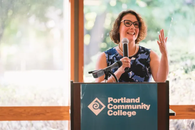 Commissioner Jessica Vega Pederson addresses attendees of the Community Energy Justice Summit on July 13.