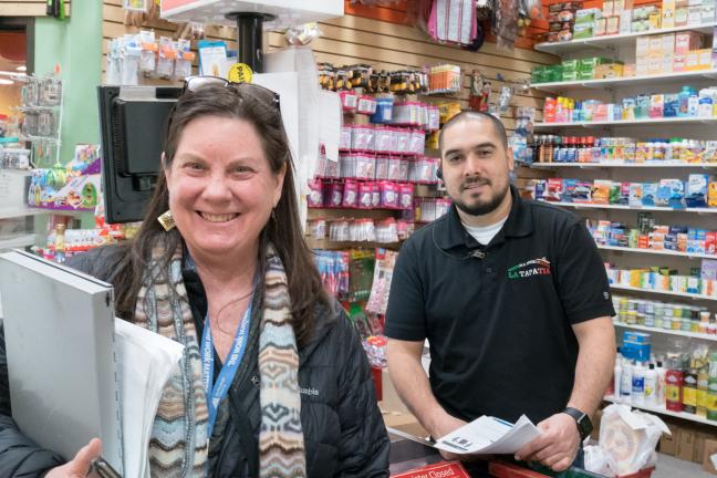 Susan Montgomery, tobacco inspector, visits with Luciano at La Tapatia Market