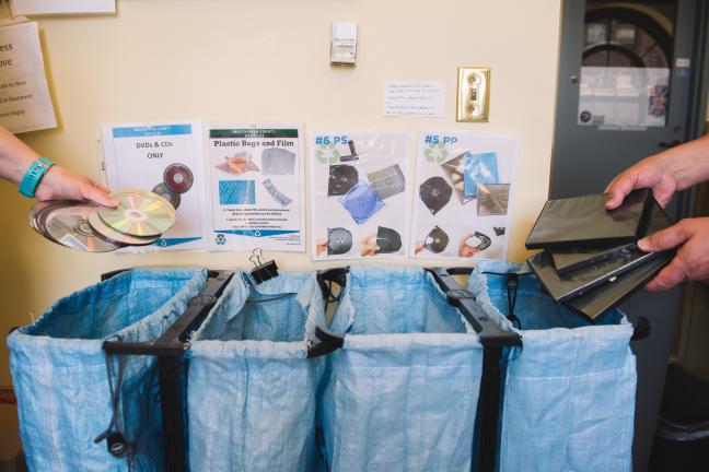 Staff sort various plastic materials at Central Library to be sent off to a specialty recycler who can accept hard-to-recycle items.