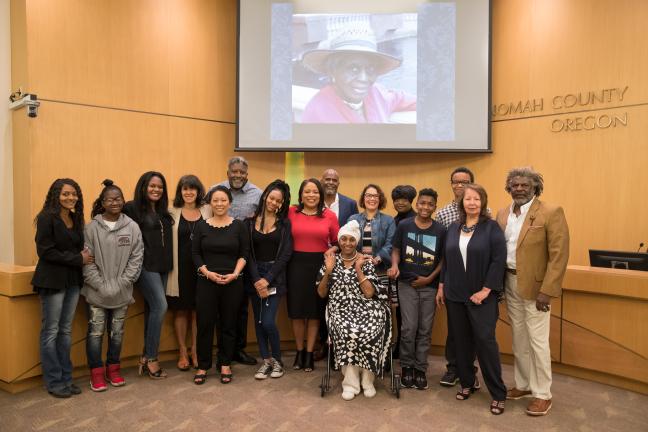 Opal Strong's family pose with County Commissioners