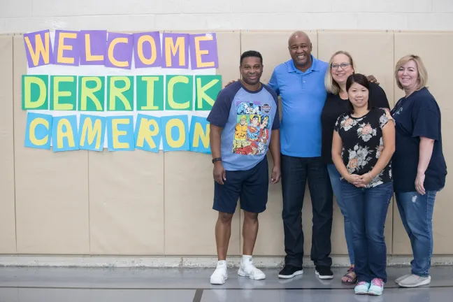 Cameron (second from left), poses with Multnomah County Juvenile Services Division employees.