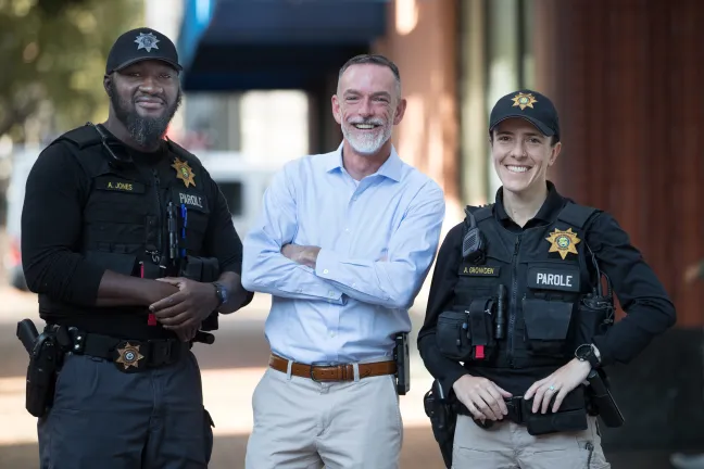 Mental Health Unit (MHU) parole and probation officer Alex C. Jones (left), Manager John McVay and MHU parole and probation officer Averyl Growden pose for photo.