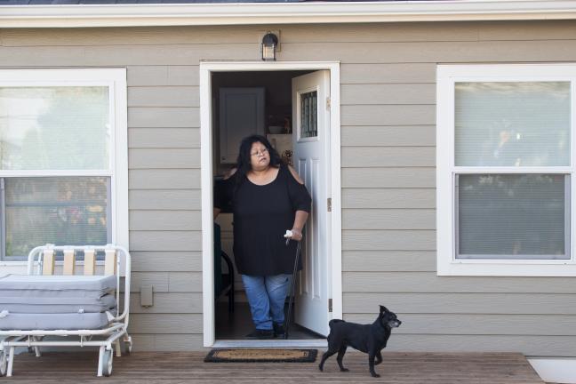 Sherry pauses in doorway of her new home.