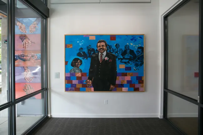 a painting of the Rev. John Garlington and his wife Yvonne hangs in the new health center bearing their name