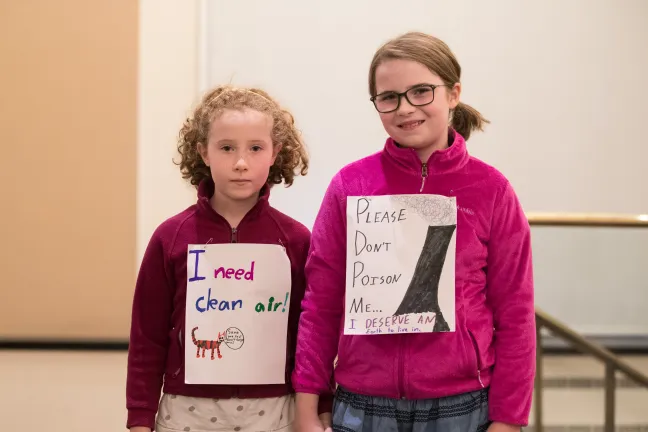 Lark, 7, and Annabelle, 10, oppose weakening emission standards.