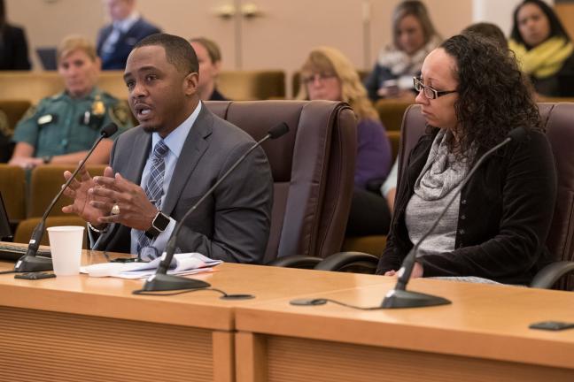 Epidemiologist Frank Franklin, Ph.D., left, briefs the Board on leading causes of death in Multnomah County alongside Public Health Director Rachael Banks.