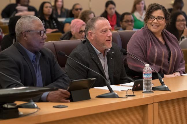 From left, Jimmy Brown, Sam Sachs and Aimeera Flint address new standard.