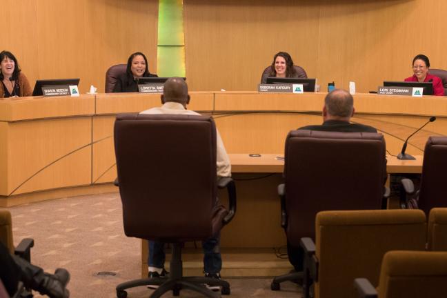 Mary McCoy, Martha Swanson, Sam Sachs and Willy McCoy address the Board.