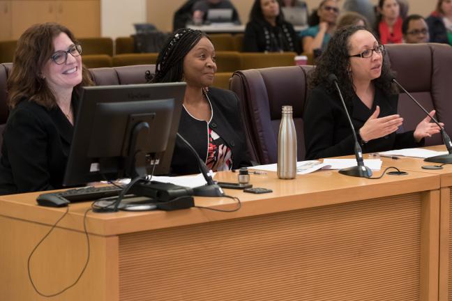 Public Health Director Rachael Banks, right, speaks alongside REACH program coordinator Tameka Brazile, center, and epidemiologist Julie Maher.