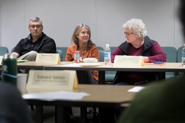 Rachel Clark, center, owner of the Goose Hollow Inn, speaks up during the final meeting of the food cart pod workgroup.