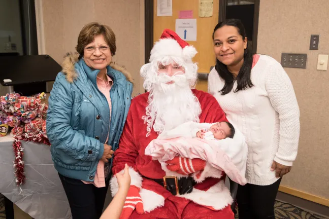 Mayra Jaimez-Mendoza, right, brought her newborn Anyela and her mother Lupita to celebrate Empezando con Salud.