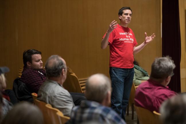 Valdez Bravo, Vice President of Healthcare for All Oregon, speaks up at town hall on universal access