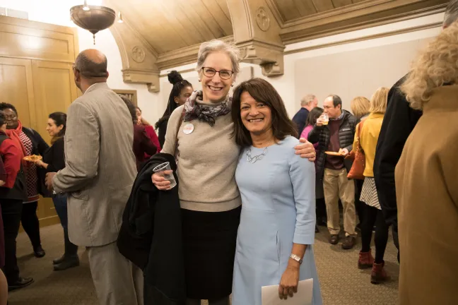 Susheela Jayapal greets one of her oldest friends, Lauren Isaac.