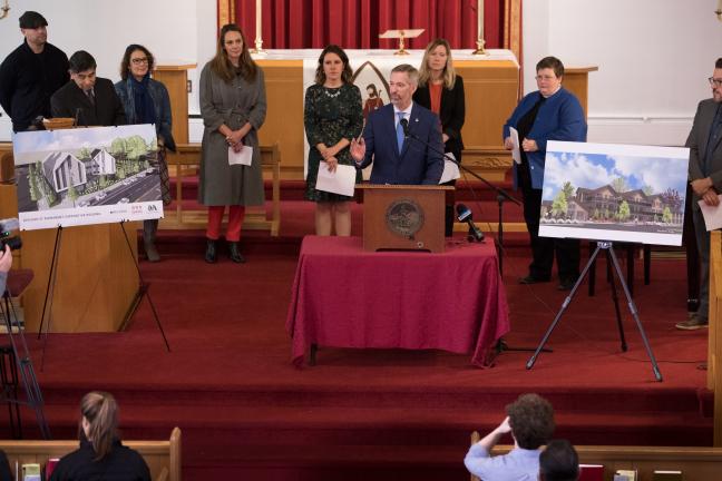 Mayor Ted Wheeler speaks at St. Mark's Lutheran Church, which is working with partners to locate supportive housing on its parking lot.