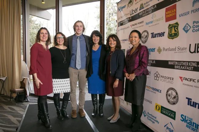 Multnomah County Commissioners pose for photo with scholarship recipient Kai Mills.