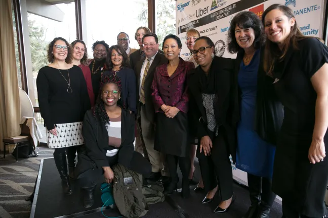 Members of Multnomah County Board, Purchasing, Health Department and more pose for photo at Skanner Foundation MLK Jr. Breakfast.