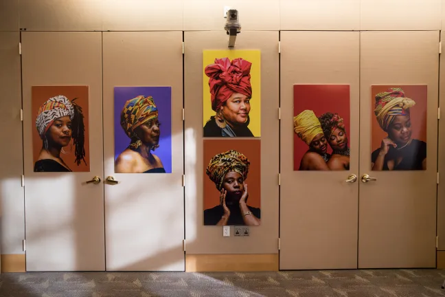 Portraits from the “Albina Queen” photo exhibition were hung on display on the walls of the Multnomah County Board Room.