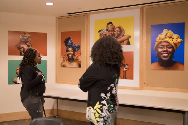 Portraits from the “Albina Queen” photo exhibition were hung on display on the walls of the Multnomah County Board Room.