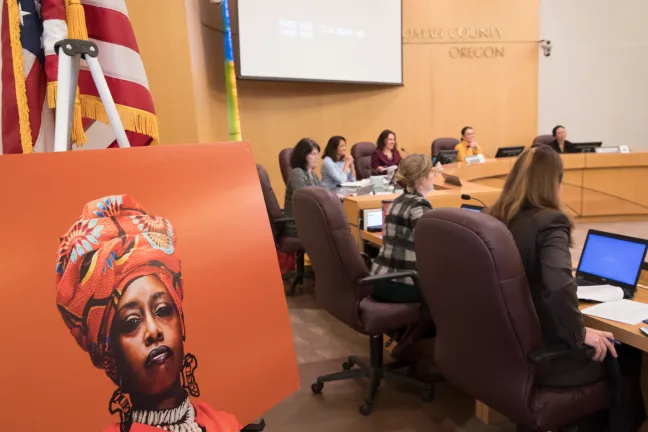Portraits from the “Albina Queen” photo exhibition were hung on display on the walls of the Multnomah County Board Room.
