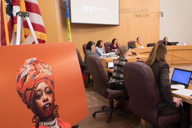 Portraits from the “Albina Queen” photo exhibition were hung on display on the walls of the Multnomah County Board Room. 