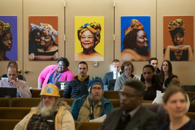 Portraits from the “Albina Queen” photo exhibition were hung on display on the walls of the Multnomah County Board Room.