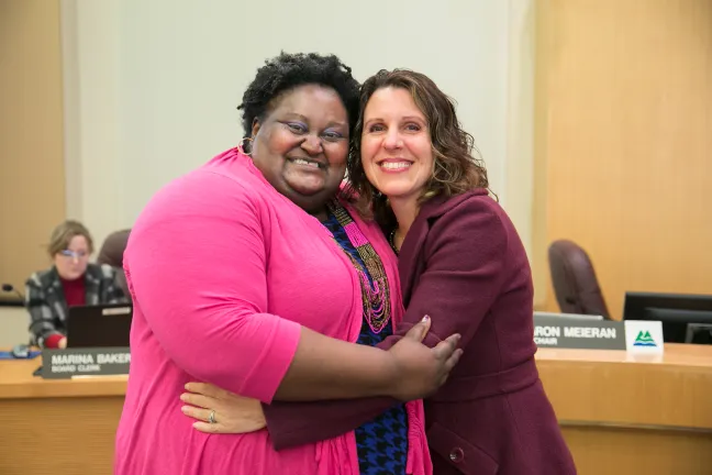 Kim Melton, Chair’s Office Chief of Staff and Chair Kafoury embrace following the Feb. 7 Board meeting.