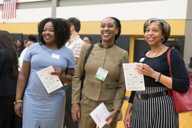 Patricia Charles-Heathers, right, chats with Interim mental health director Ebony Clarke, left and Clinical Services Director Vanetta Abdullatif, center, at a Say Hey! event in February.