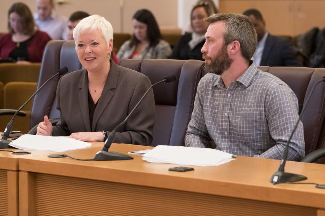 Environmental Health Services Director Jae Douglas, Ph.D., left, testifies alongside inspection supervisor Jeff Martin, on gaps in health oversight for food cart pods.