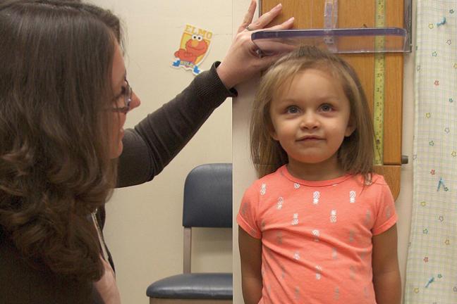 girl being measured at a clinic