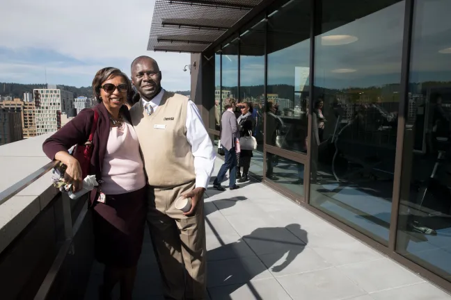 Clinic director Vanetta Abdullatif visits the Health Department roof deck with clinic advisory board member Harold Odhiambo