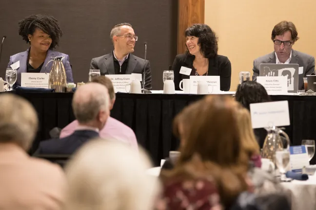 Panelists Ebony Clarke, left,  along with Jeffrey Eisen, Sharon Meieran and Kevin Fitts talk about the shortcomings and opportunities in behavioral health