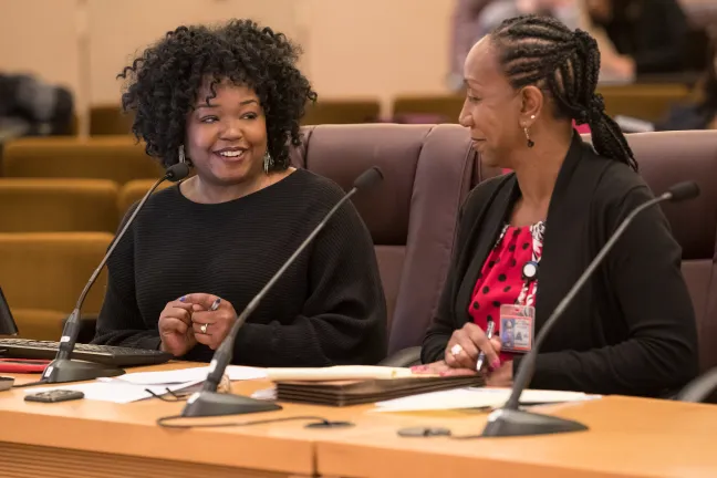 Mental Health and Addiction Services Division Director Ebony Clarke, left and Health Department Director Patricia Charles-Heathers brief Commissioners on system of behavioral health