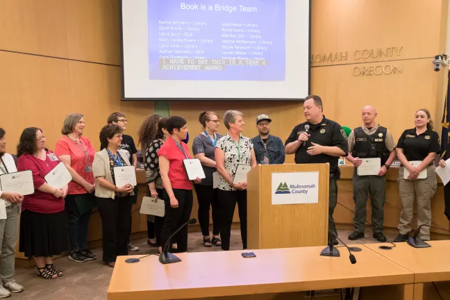 Members of the Book is a Bridge Team accept their award for Outstanding Team Achievement.