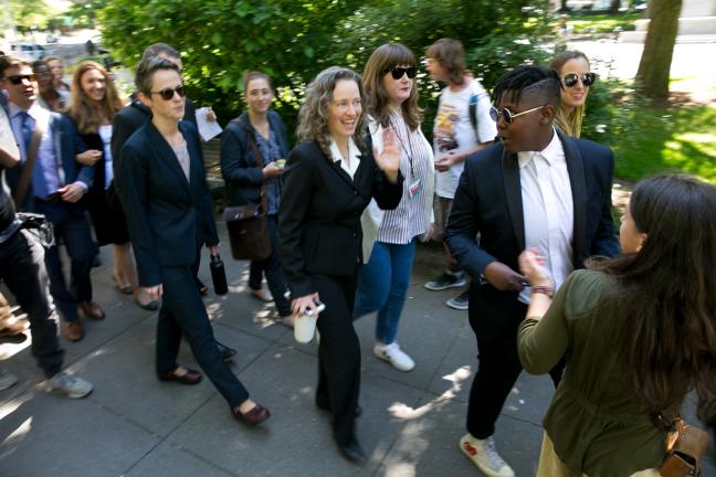 The Youth's attorney Julia Olson is greeted by cheers after arguing before the Ninth Circuit Court of Appeals..