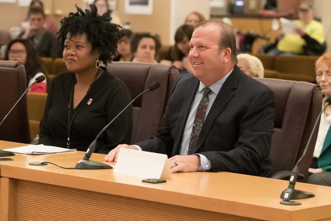 Department of Community Justice director Erika Preuitt (left) and Greg Hockert, (right) the County’s strategic project manager present before the Multnomah County Board.