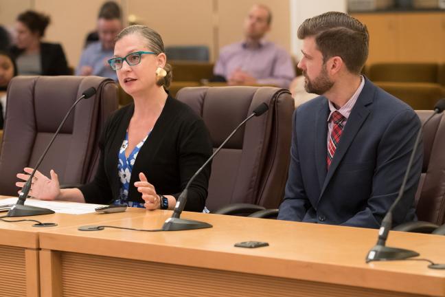 Executive Director of Multnomah County's Local Public Safety Coordinating Council, Abbey Stamp (left) and Mike Schmidt, executive director of the Criminal Justice Commission speak before board. 